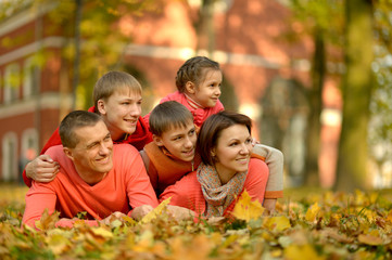 Fototapeta premium Portrait of family relaxing in autumn park