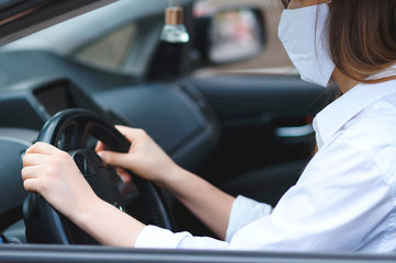 woman holding wheel in car