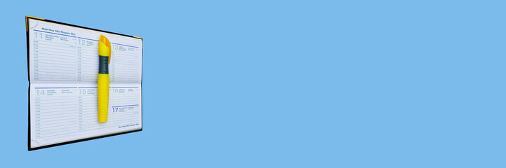organizer and permanent yellow marker on blue  background, panoramic banner concept, Images with...