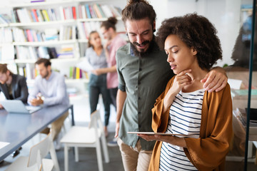 Portrait of business people, architects having discussion in office