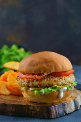 hamburger with chicken cutlet and tomatoes