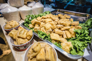 Chinese food on a stand in indoor food market located on Qianmen Street in Beijing capital city of China