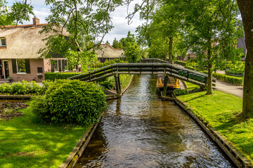 Typical Dutch houses and gardens in Giethoorn, The Netherlands