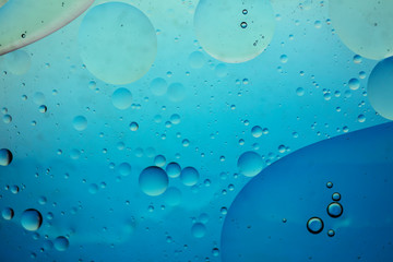 Abstract colourful creative macro oil and water background with bubbles.