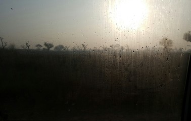 Close-up Of Water Drops On Glass Window