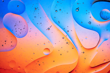 Abstract colourful creative macro oil and water background with bubbles.