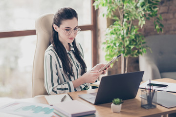 Close-up portrait of nice attractive smart clever focused girl using ebook researching market cv...