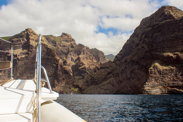 Fototapeta premium View of the Mask gorge from the ocean. The end of the trail along the Mask gorge. Observation bridge on the bow of the boat.