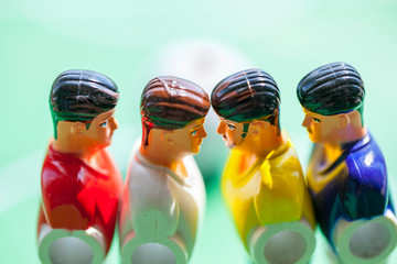 Foosball plastic players. The confrontation players.