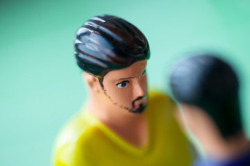 Foosball plastic players. The confrontation players.