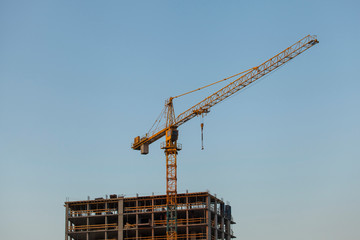 construction site with crane against the blue sky	