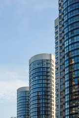 Obraz premium Modern and new apartment buildings. Multistoried modern, new and stylish living block of flats. Real estate. New house.Newly built block of flats