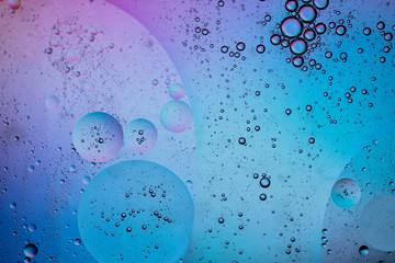 Abstract colourful creative macro oil and water background with bubbles.