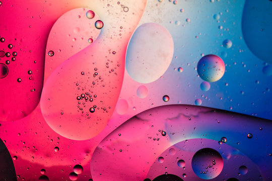 Abstract colourful creative macro oil and water background with bubbles.