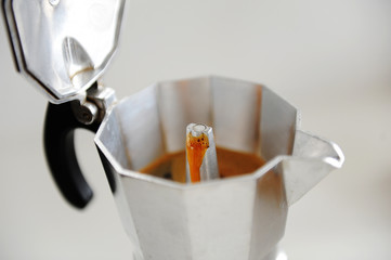 Coffee brewing in Italian moka pot close up