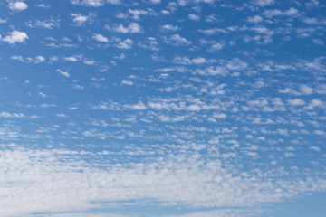 Thin white clouds over the blue sky.