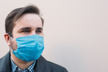 Protection against contagious disease, coronavirus. Man wearing hygienic mask to prevent infection, airborne respiratory illness such as flu, 2019-nCoV