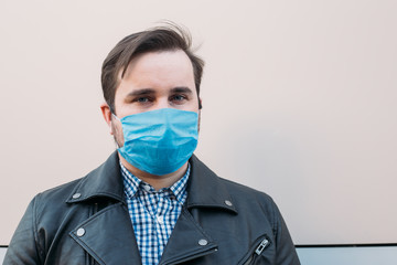 Man wearing hygienic mask to prevent infection, airborne respiratory illness such as flu, 2019-nCoV