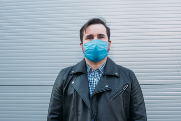 man in the street wearing protective masks. Sick man with flu wearing mask, epidemic flu concept on the street.