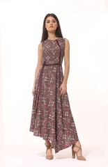 Fototapeta premium young brunette business woman executive posing in long brown short sleeve dress full body length isolated on white