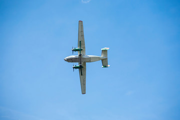 old transport plane flies at an air show