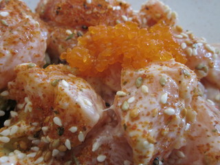 Salmon bowl with rice, avocado, whitefish roe on sushi and wok restaurant