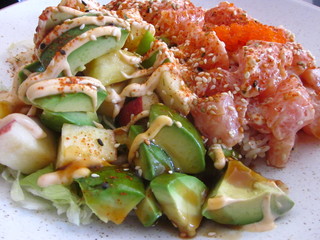 Salmon bowl with rice, avocado, whitefish roe on sushi and wok restaurant