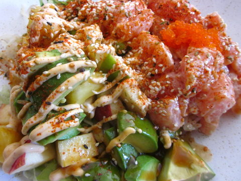 Salmon bowl with rice, avocado, whitefish roe on sushi and wok restaurant
