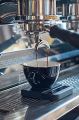 espresso machine pouring espresso