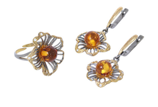 Amber jewelry set: earrings and brooсh. Baltic amber. Vintage style fashion classic jewelry. Isolated image. 