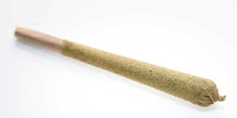 Alternative medicine close up on kief joint with marijuana  CBD white background