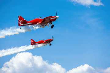 sport aircraft perform acrobatics at air shows