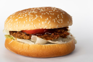 Homemade fried pork hamburger on a white background.