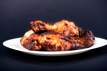 Juicy grilled chicken drumsticks marinated in soy sauce.