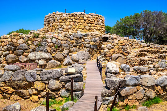 Arzachena, Sardinia, Italy -Archeological ruins of Nuragic complex La Prisgiona - Nuraghe La Prisgiona - with stone main tower and preserved remaining of Neolithic fortress