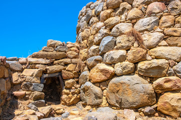 Arzachena, Sardinia, Italy - Archeological ruins of Nuragic complex La Prisgiona - Nuraghe La Prisgiona - with main entrance to stone tower of Neolithic fortress