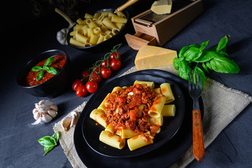Rigatoni pasta with Bolognese sauce and fresh basil