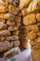 Arzachena, Sardinia, Italy - Archeological ruins of Nuragic complex La Prisgiona - Nuraghe La Prisgiona - with interior of stone tower of Neolithic fortress