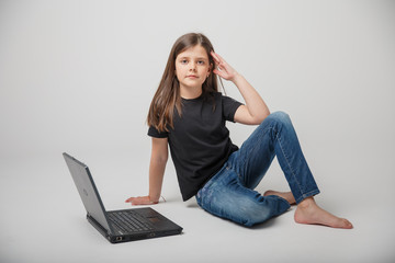 girl is engaged on a laptop remotely on a white background