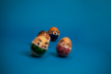 bunch of eggs with eyes and masks on a blue background
