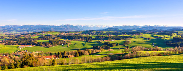 Panorama landscape with mountains and meadows in spring. Allgäu, Bavaria, Germany