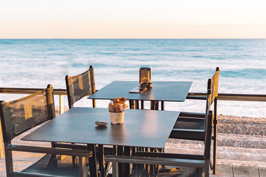 Empty Beach Cafe Without Visitor, People. Empty Beach Chair, Table, Bay, Seaside, No Tourist. Travel Ban In Europe. Tourist Season COVID-19. Closed Restaurant,public Places On Coronavirus Quarantine.