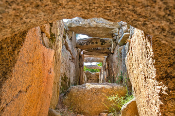 Arzachena, Sardinia, Italy - Archeological ruins of Nuragic necropolis Giants Tomb of Coddu Vecchiu  - Tomba di Giganti Coddu Vecchiu - with interior of gallery grave of Neolithic cemetery