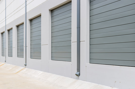 Empty Warehouse Loading Dock White Walls Gray Metal Sliding Doors