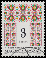 Stamp printed in Hungary shows Folk Art motives