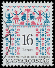 Stamp printed in Hungary shows Folk Art motives