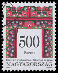 Stamp printed in Hungary shows Folk Art motives