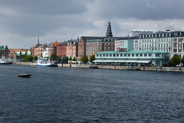 Obraz premium Kobenhavn/ Kopenhagen, a colourful danish city, right at the seefront. Lots of old historic buildings and lovely green parks.