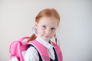 Red-haired schoolgirl indoors