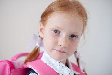 Red-haired schoolgirl indoors